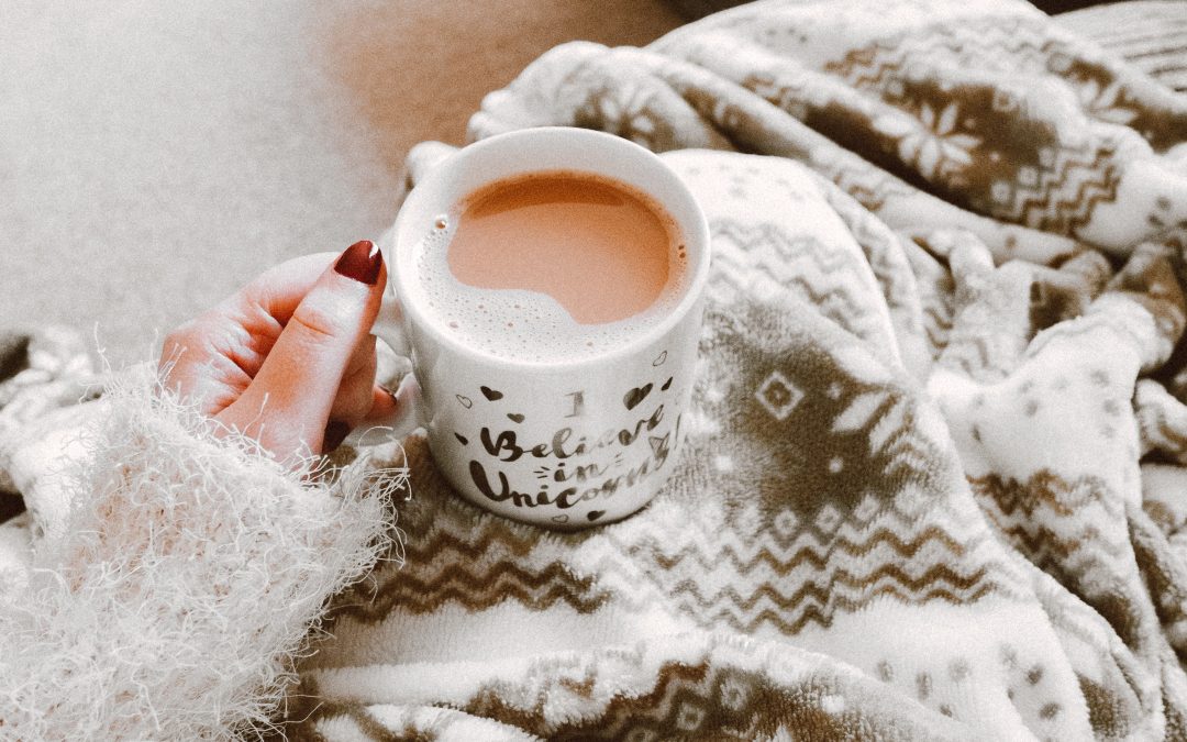 Person holding a coffee cup